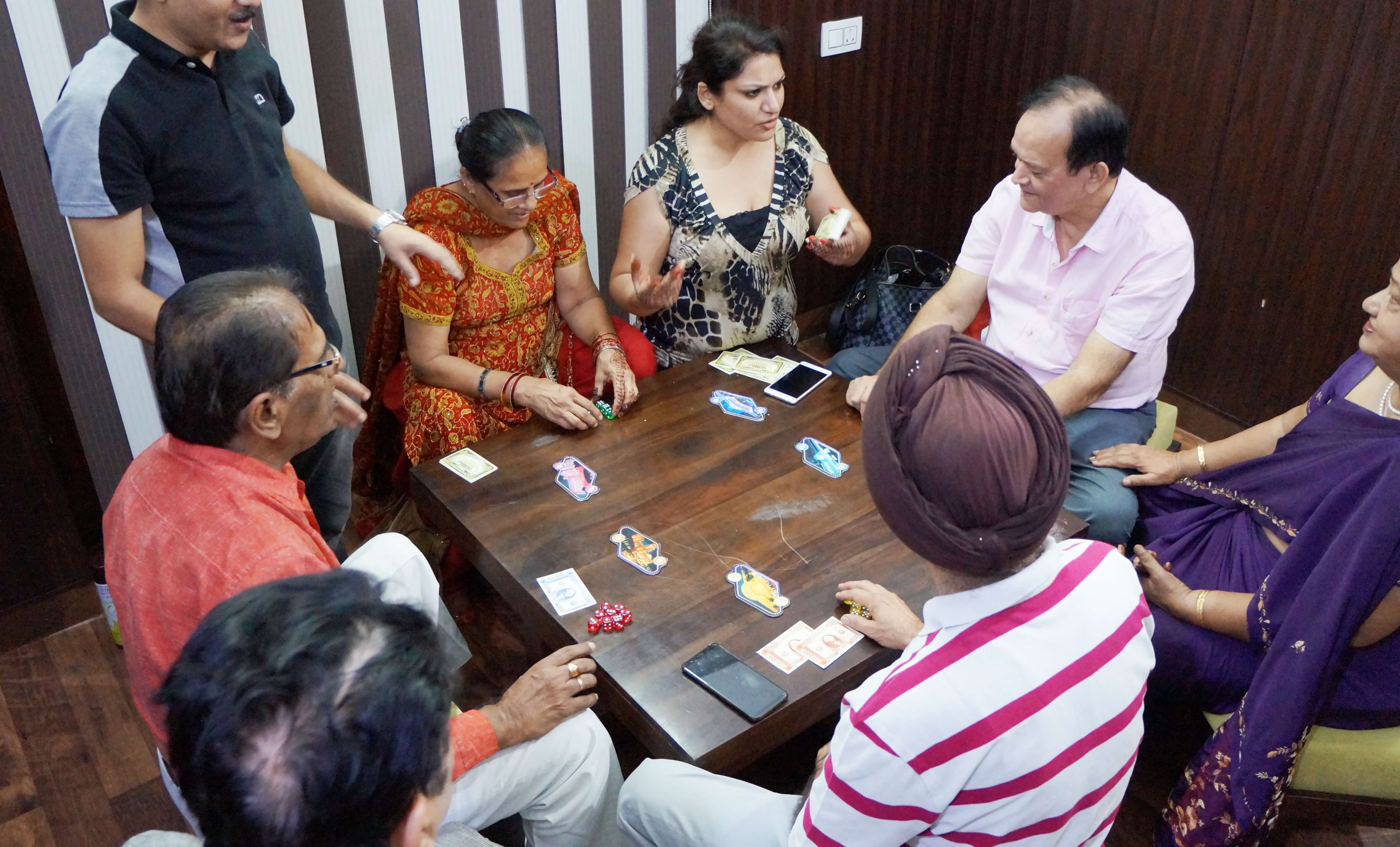 I-Serve members playing a board game together